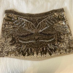 All Saints gold embellished mini skirt.
